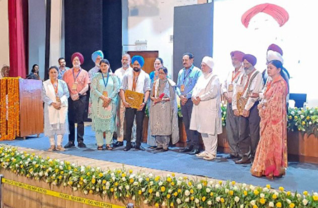 Chancellor Dr. Zora Singh honored the family of late Surjit Patar